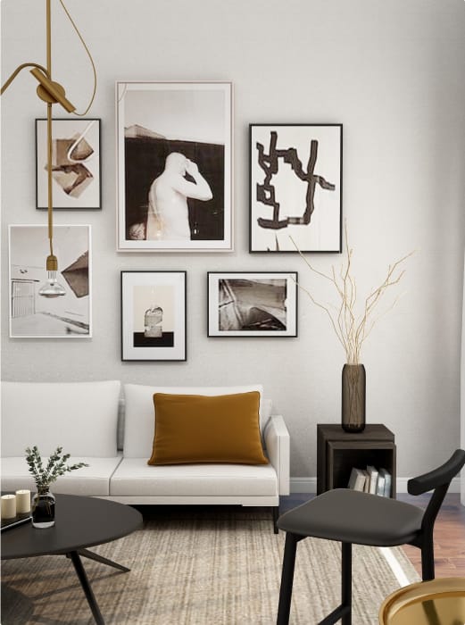 a living room with pictures on the wall